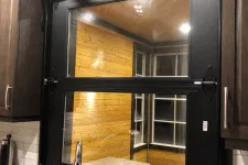 The California garage door over a kitchen sink. Inside of the door from the kitchen